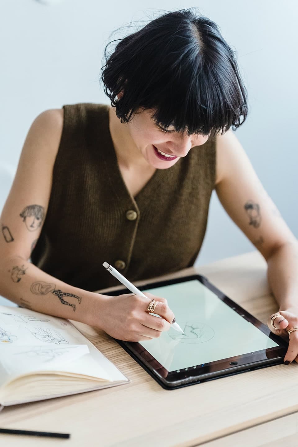 A person smiling while on a support call, representing customer contact.